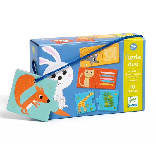 The "Djeco Educational Puzzles Duo Dinner’s Ready!" box features playful animal illustrations with ten educational matching game puzzles for ages 2 and up. A colorful box, it depicts a white rabbit, and a puzzle piece with a red squirrel is attached to the side.