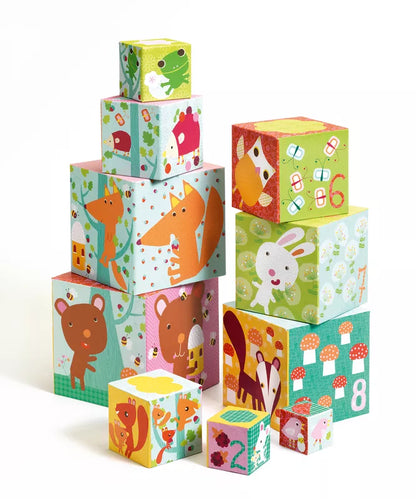 A stack of Djeco 10 Forest Blocks Stacking Blocks with animals on them.