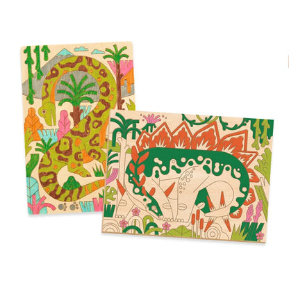 Two colorful Djeco Drawing & Colouring Dino world puzzles featuring jungle themes with laser-engraved illustrations including animals like an elephant and tropical plants.