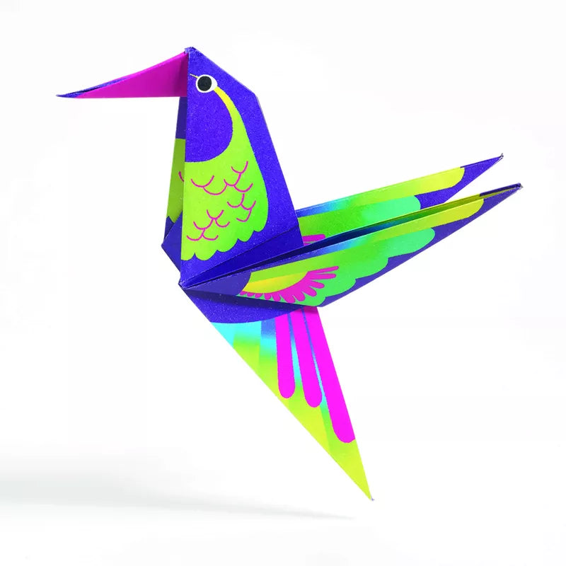 A vibrant Djeco Origami Tropics hummingbird soaring through the tropical sunshine.