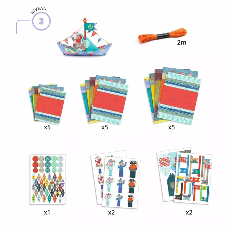 A picture of Djeco Origami Floating Boats and some cards.