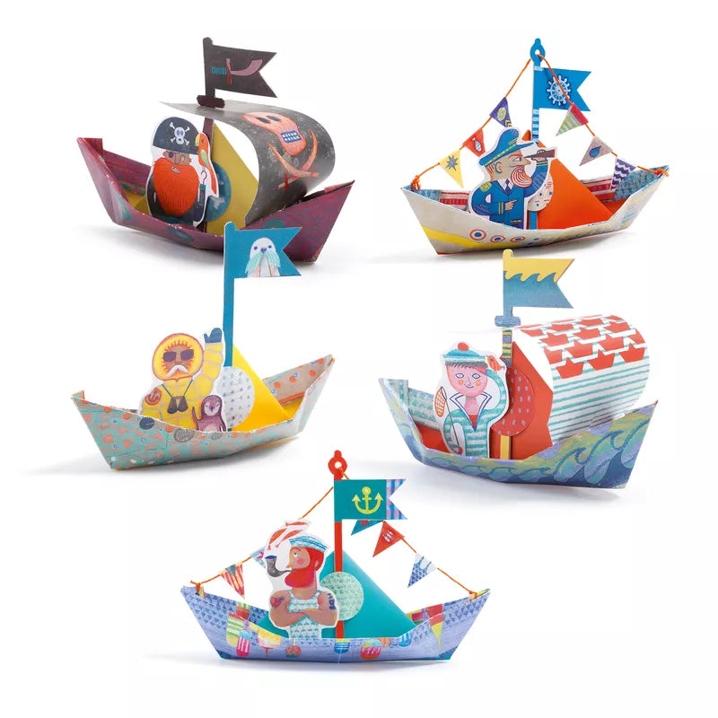 A set of four Djeco Origami Floating Boats with different designs.