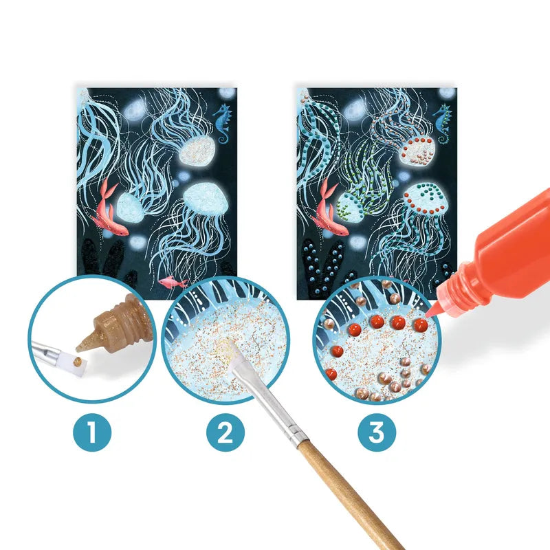 A step-by-step tutorial showing how to create a glittery sea-themed painting using a Djeco Painting Abysses kit, glitter, and a brush. Three stages depict applying glue, adding glitter, and the finished sparkly masterpiece.