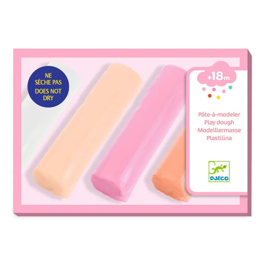 A set of Djeco "4 Rolls of Play Dough Sweet" featuring four pastel-colored dough rolls, including shades of yellow, pink, and light pink. The packaging indicates the modeling clay is gluten-free, suitable for ages 18 months and older, and non-drying.