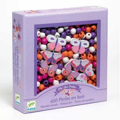 A purple Djeco box filled with lots of Djeco Wooden Beads Butterflies.