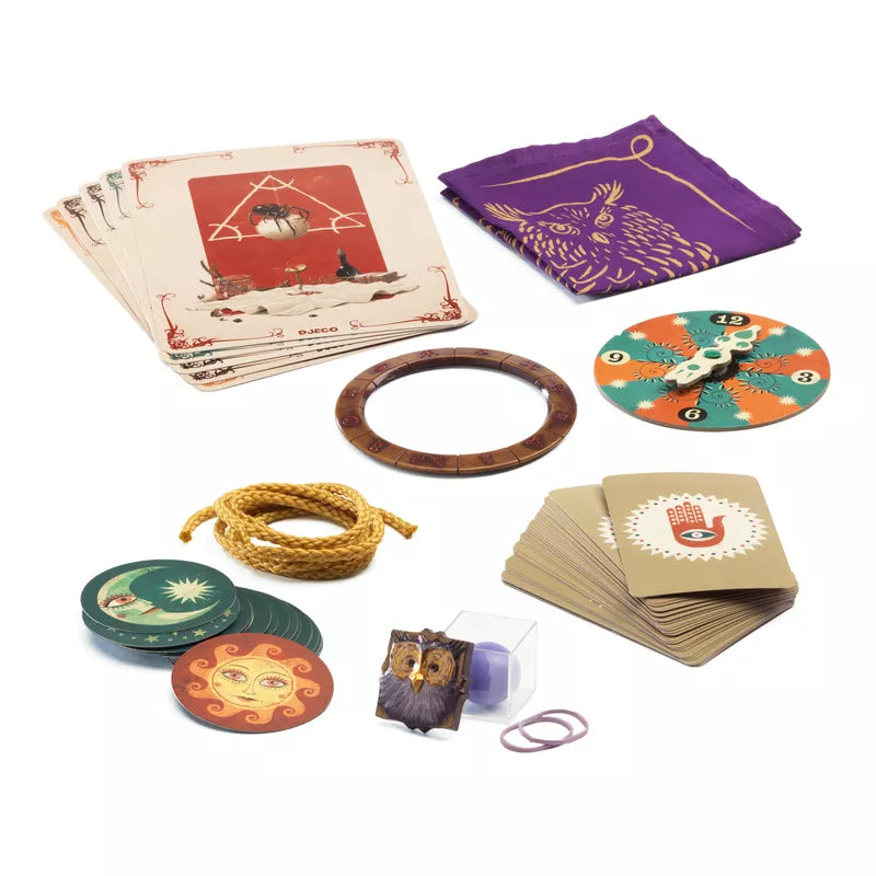 A collection of various items including a Djeco 20 Magic Tricks kit, ring, bracelet, and other items.