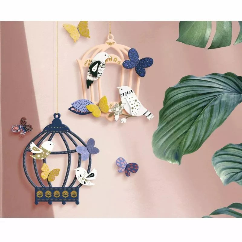A creative activity that involves decorating bird cages with Decoration Kit Birdhouses and leaves hanging from them.