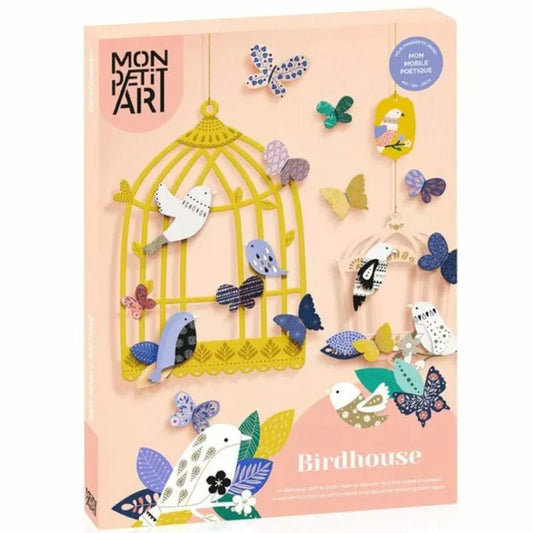 A creatively decorated Decoration Kit Birdhouse with birdcages housing a variety of birds.