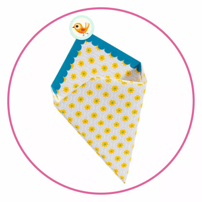 A yellow and white polka dot paper cone, perfect for Djeco Origami Small boxes or as a Djeco Toy.