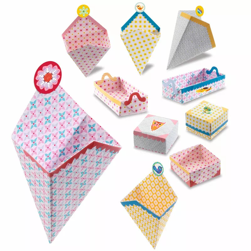 A set of Djeco Origami Small boxes with different designs on them, perfect for origami enthusiasts or as a Djeco Toy.