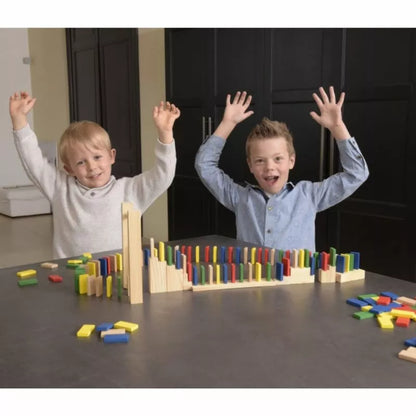 Two boys are playing with Domino Rally Construction Game in front of a table.