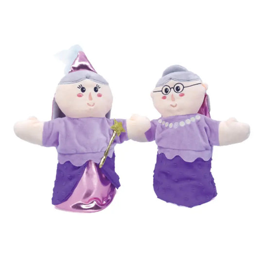 The Double-Face Hand Puppet Grandma-Fairy features two plush characters in purple outfits: one with a pointed hat and star wand, the other with glasses and a pearl necklace. Both have friendly faces and gray hair, perfect for creative play.