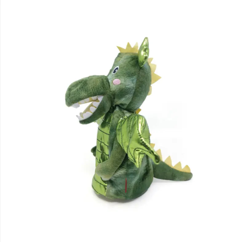 Side view of the green Hand Puppet Dragon with yellow spikes, big snout, white teeth, and pink cheeks, sitting upright on a white background—ideal for imaginative play or storytelling.