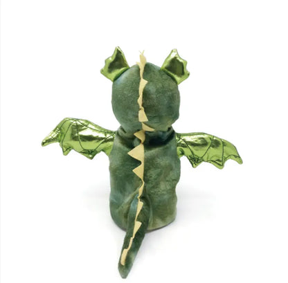 The Hand Puppet Dragon is a green plush toy shaped like a dragon, shown from the back, with shiny green wings, pointed ears, and a yellow zigzag spine—ideal for inspiring imaginative storytelling play.