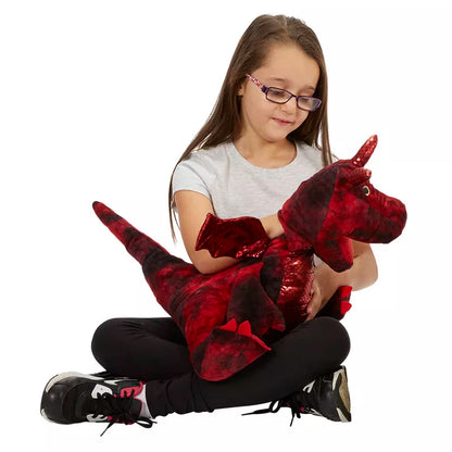 A young girl holding an Enchanted Red Dragon Hand Puppet during a storytelling session for language development.