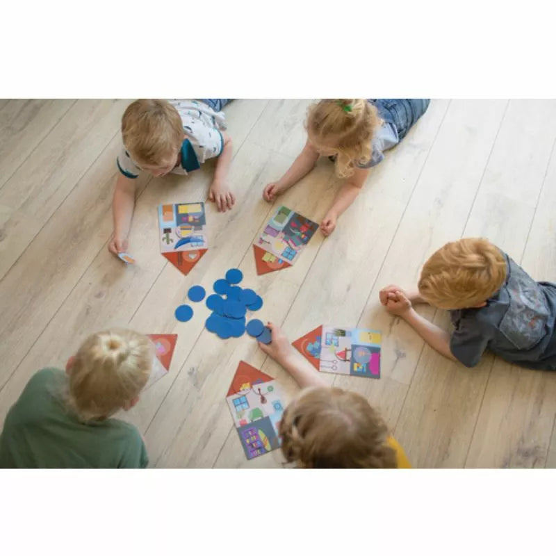 A group of children sitting on the floor playing with Buitenspeel Dream House Lotto puzzles.