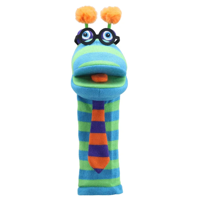 The Puppet Company Sockette Puppet Dylan is a colorful striped puppet featuring blue and green alternating bands. It has two eyes with glasses, an orange nose, and orange pom-poms on antennae at the top. The entertaining toy’s mouth is orange inside, equipped with a squeaker tongue, and it wears a blue and orange striped tie.