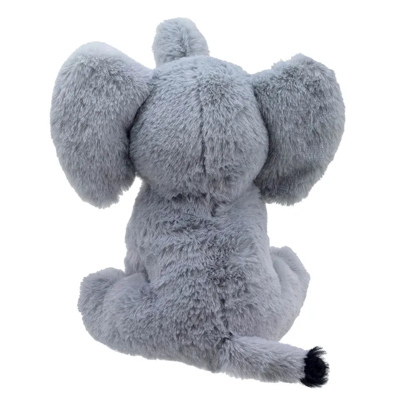 Ella the Elephant ECO Cuddlies, in gray, sits facing away, highlighting its large ears and soft recycled-material fur with a small black tuft on its tail.