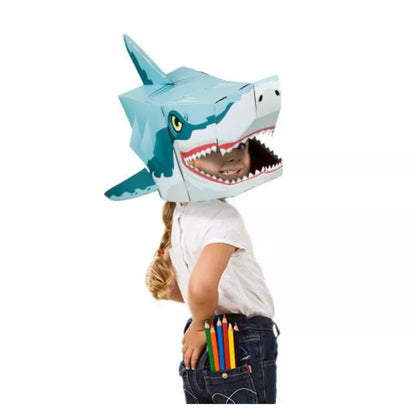 A child wearing a Shark 3D Mask with a pencil in his mouth.