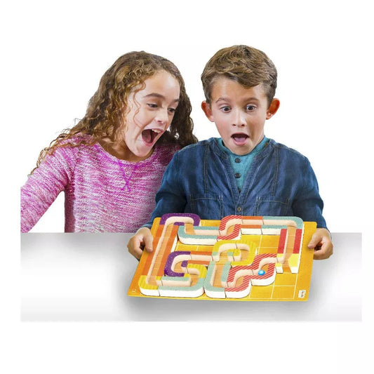 A boy and a girl holding Magnetic Maze Kraze Game.