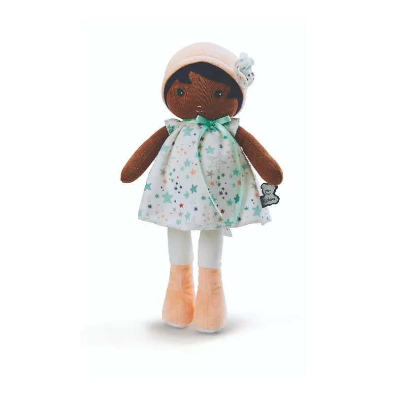 a Kaloo Manon K First Doll Medium wearing a dress and hat.