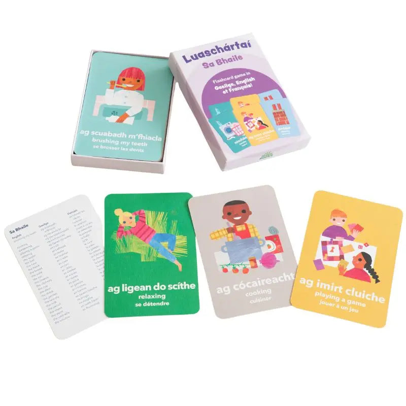 Luaschártaí - Sa Bhaile" is a set of illustrated trilingual flashcards showing kids doing daily activities, with vocabulary in Irish, English, and French—ideal for early language learning at home.