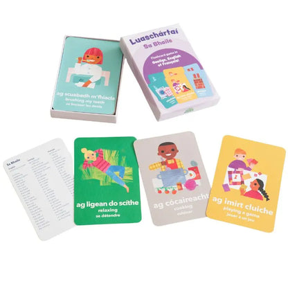 Luaschártaí - Sa Bhaile" is a set of illustrated trilingual flashcards showing kids doing daily activities, with vocabulary in Irish, English, and French—ideal for early language learning at home.