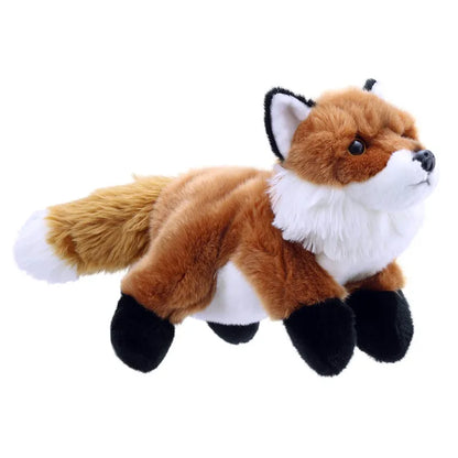 The Puppet Company Full-bodied Hand Puppet Fox is a plush toy with soft, brown fur, a white underbelly and face, and black paws and ears. Designed to encourage imaginative play, this fox hand puppet is positioned as if lying down. Its bushy tail extends to the left against a solid white background.