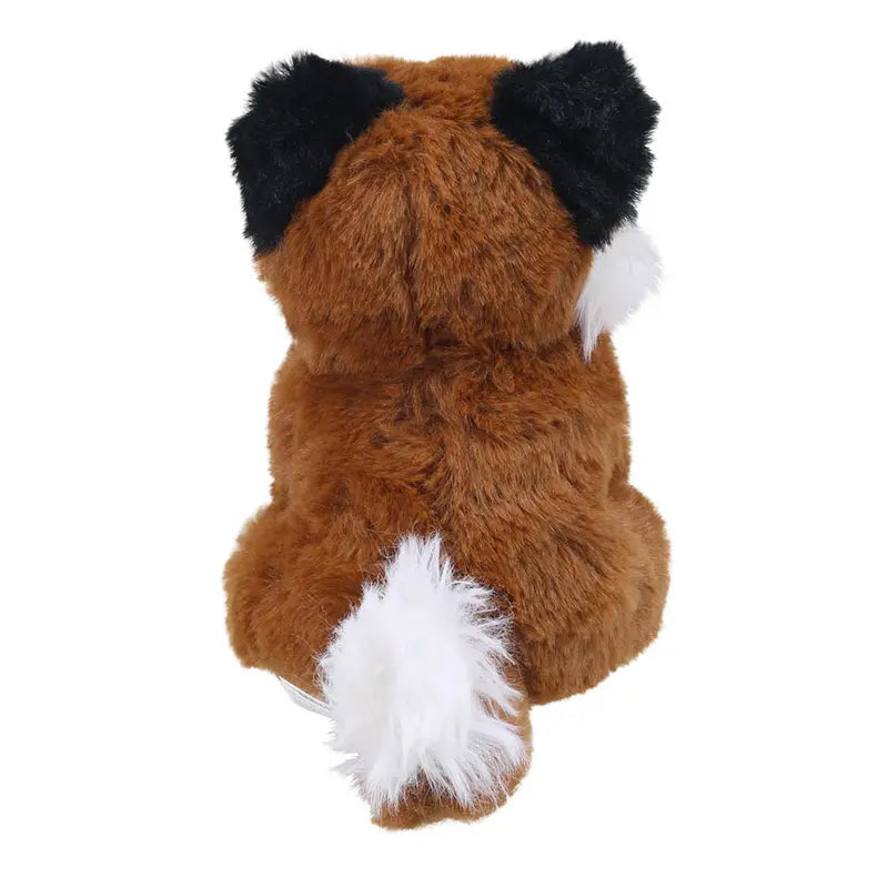 The Wilberry Eco Mini Fox is a plush toy made from eco-friendly, recycled materials, featuring brown fur, black ears, and a fluffy white-tipped tail as it sits with its back to the viewer.