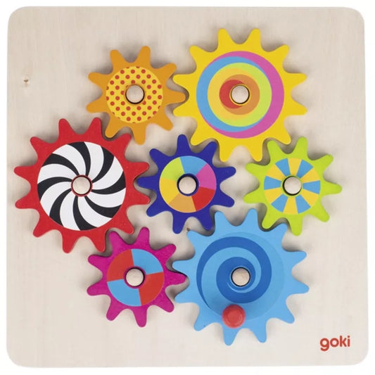 A colorful Goki Cogwheel Game featuring cogs on a wooden board.
