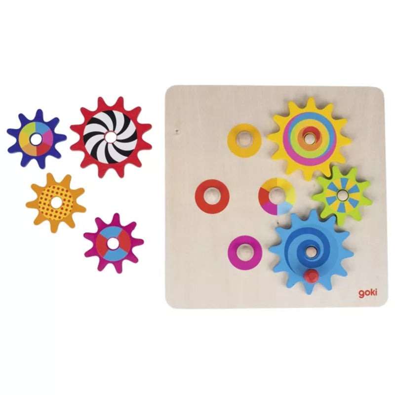 A Goki Cogwheel Game wooden puzzle with cogs on a wooden board.