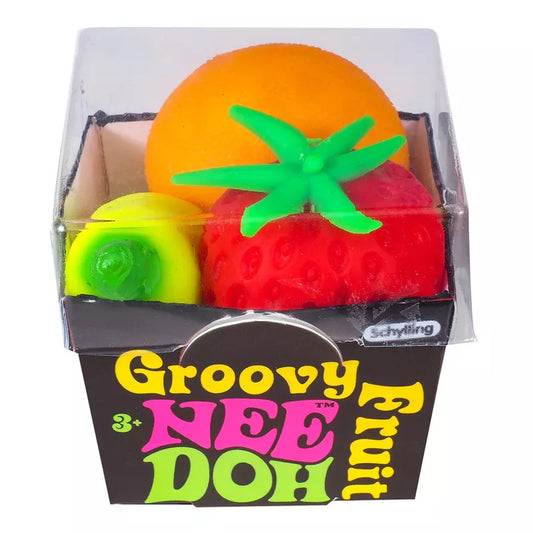 Sentence with replaced product name: A colorful package of "Groovy Fruits Needoh" containing three fidget toys shaped like fruit: an orange, a strawberry, and a lime, against a white background.