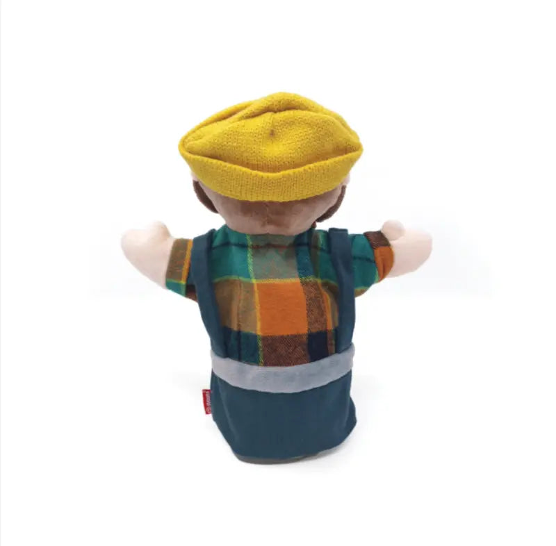 The Hand Puppet Hunter, ideal for storytelling, features outstretched arms, a yellow knit hat, blue overalls, a green-orange-blue plaid shirt, and a visible side tag when viewed from behind.
