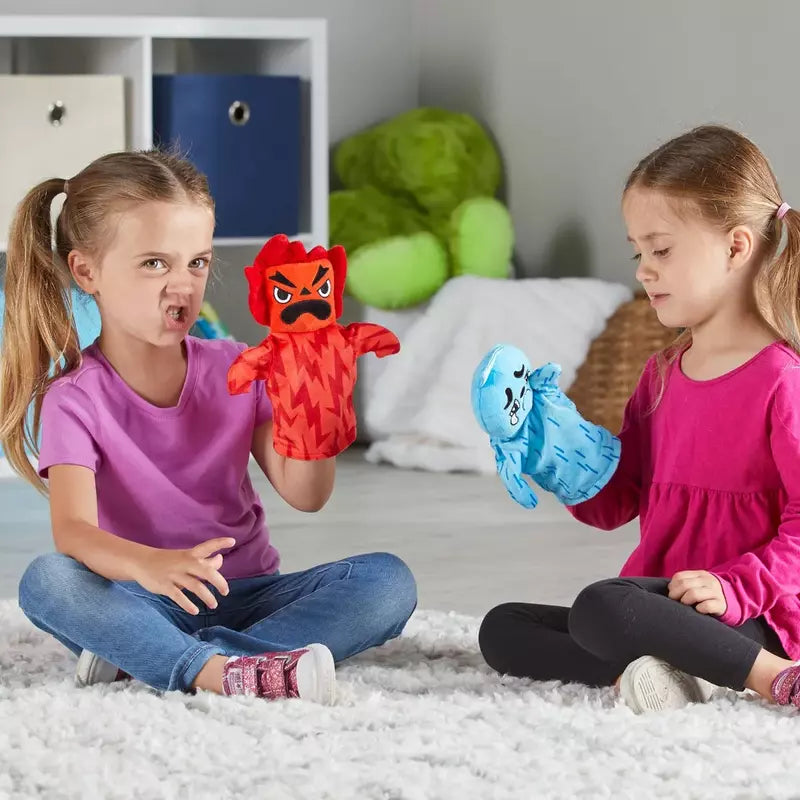 Two girls engaging in sensory play with their Learning Resources Feelings Family™ Hand Puppets, expressing their feelings and emotions as they sit on the floor.