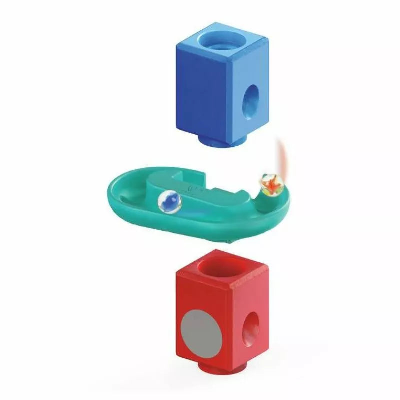 a Hape Cliffhanger toothbrush holder with a toothbrush in it.
