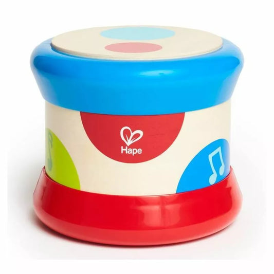 A colorful Hape Baby Drum toy with music notes on it.