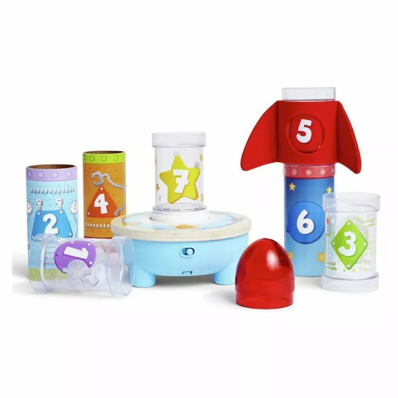 A group of Hape Rocket Ball Air Stackers that are on a white surface.