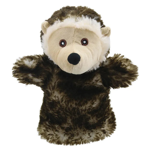 A ECO Puppet Buddies Hedgehog hand puppet with brown and white fur, standing upright with its arms outstretched, and featuring a friendly facial expression.