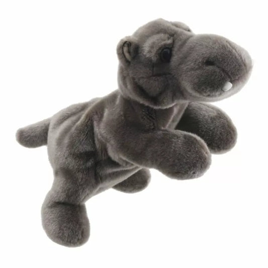 A The Puppet Company Full-bodied Hand Puppet Hippo stuffed animal is flying in the air.