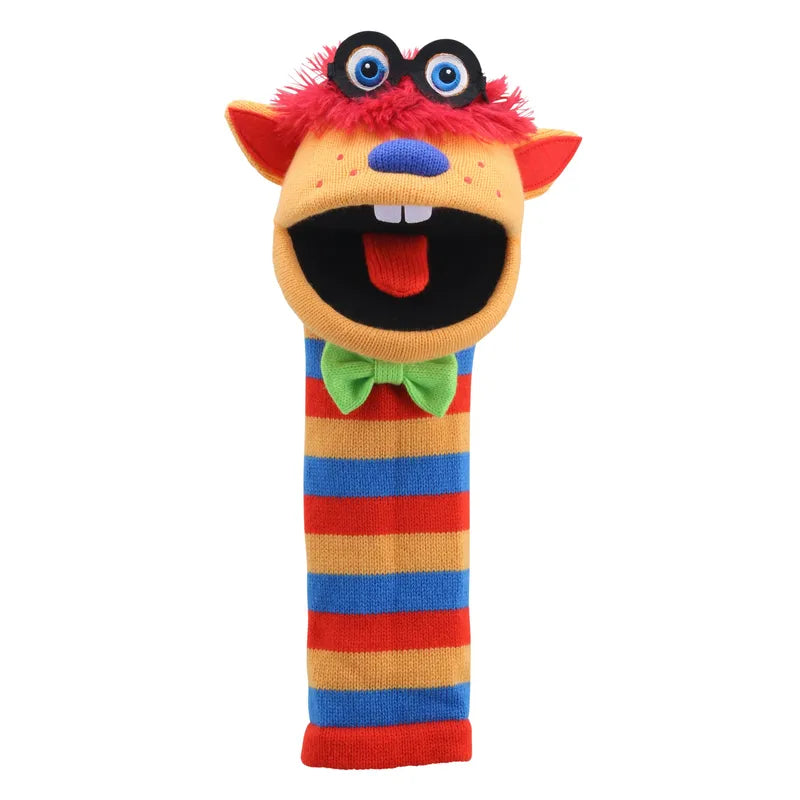 The Puppet Company Sockette Humphrey puppet boasts a vibrant design with orange, pink, and blue fur. It features large googly eyes, a black mouth with a red tongue, and is adorned with a green bow tie. The body is whimsically striped in red, orange, blue, and yellow for added charm.