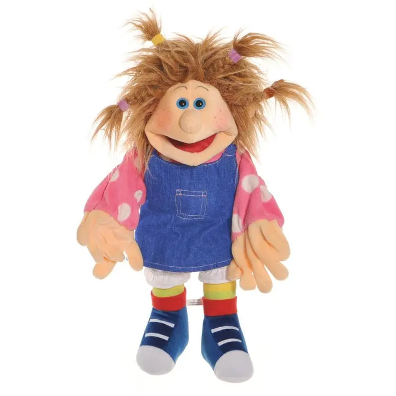The Ilselotte Girl Hand Puppet is a cheerful 45cm puppet with messy brown pigtails, blue eyes, a big smile, and dressed in a pink spotted shirt, blue denim dress, striped leggings, and blue shoes.