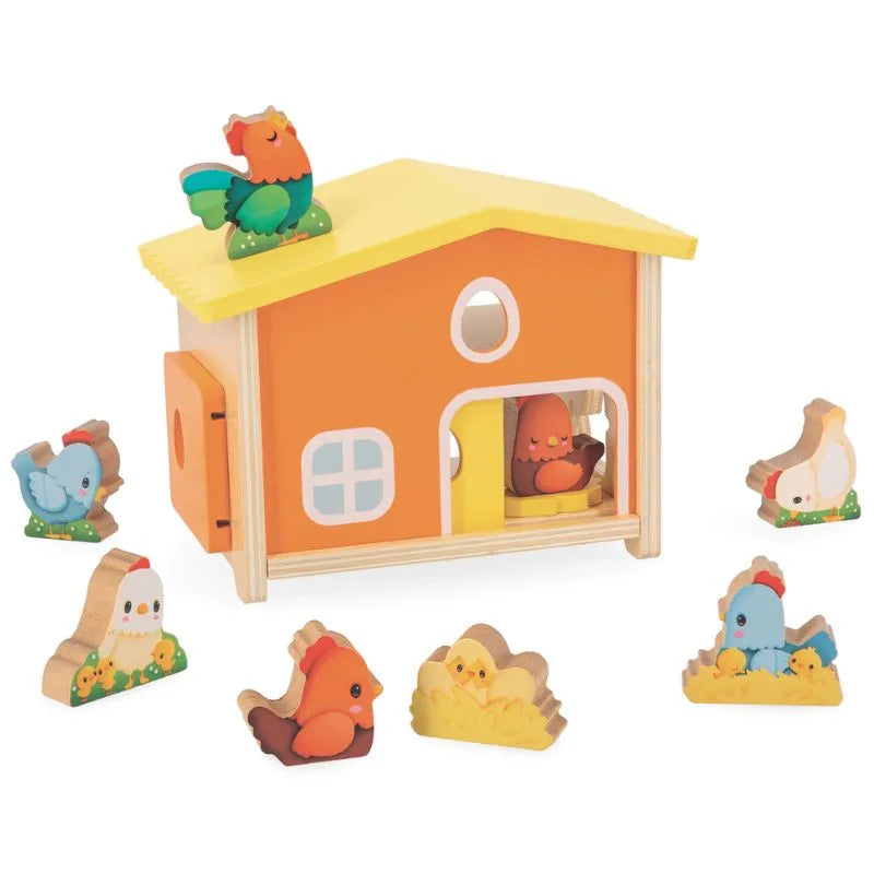 The Janod Farm - My First Chicken Coop, a charming wooden toy barn with a yellow roof and orange walls, is surrounded by various colorful wooden bird figures. Some birds are positioned outside around the barn, while one bird is visible inside. Designed as an educational toy for toddlers, this delightful chicken coop features several windows and a door.