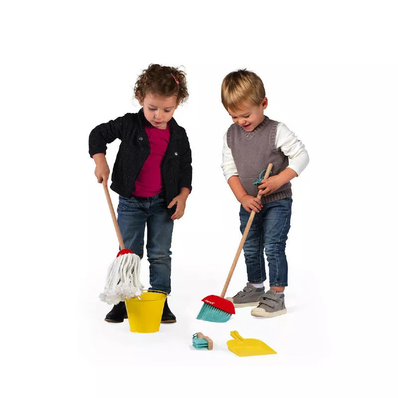 Two young children playing with a Janod Cleaning Set.