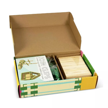 a Join Clips Construction Home Edition 200 box with a book inside of it.