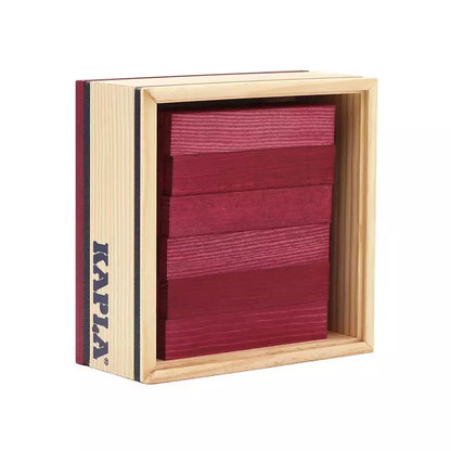 A KAPLA® 40 Coloured Planks Purple box with a red piece of wood in it.