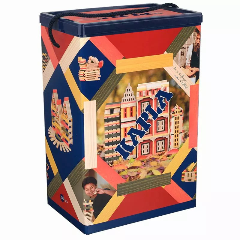A colorful tin box with a collage design featuring architectural elements, photos, and the word "India" in bold letters. The KAPLA® 200 Autumn Box has a handle on top for carrying and is inspired by open-ended play.