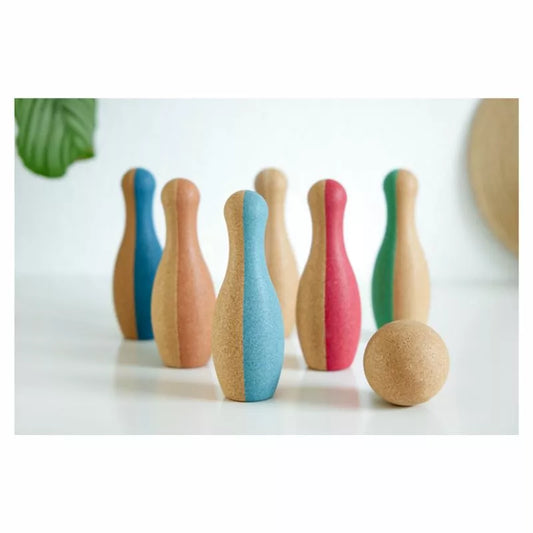 A group of Korko Bowling Set pins sitting next to each other.
