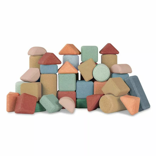 A pile of Korko Tall Architects blocks and shapes on a white background.