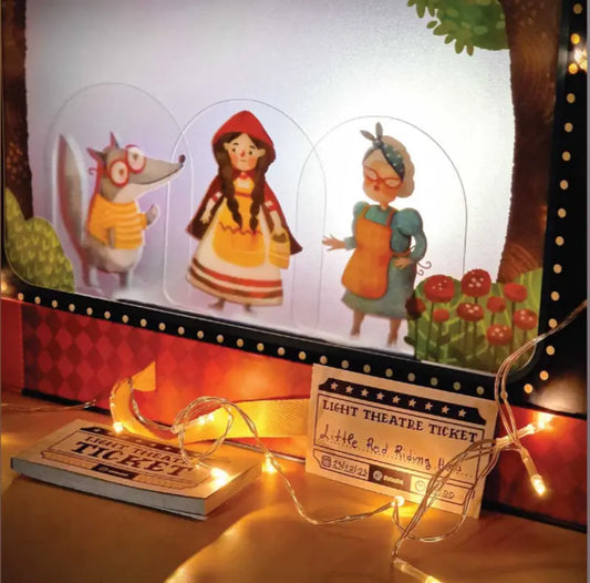Experience the magic of Shadow Theatre – The Amazing Light Theatre of Wonders, featuring paper puppets (wolf, Little Red Riding Hood, grandmother) and glowing string lights for an enchanting “Little Red Riding Hood” shadow play storytelling toy.