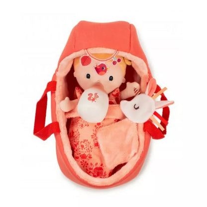 A Lilliputiens Baby Lena doll in a pink bag.
